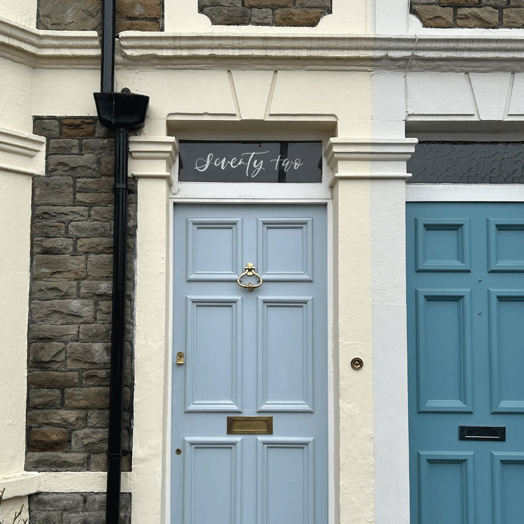 Hand-lettered custom door number window film