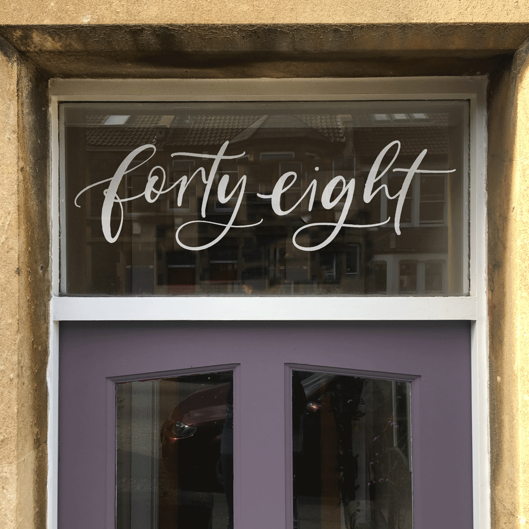 Hand Lettered Bespoke Door number window film by Blossom & Brush